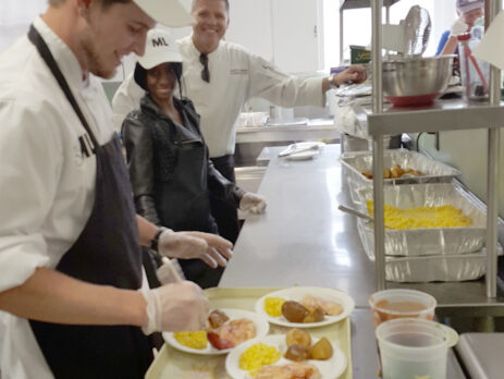 Cafe ML chefs preparing tray of food